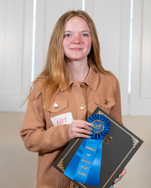 Elizabeth Zurek poses with her award